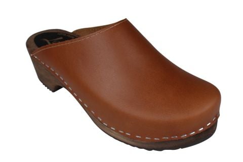 Women's clogs shoes in cinnamon on brown wooden clogs base