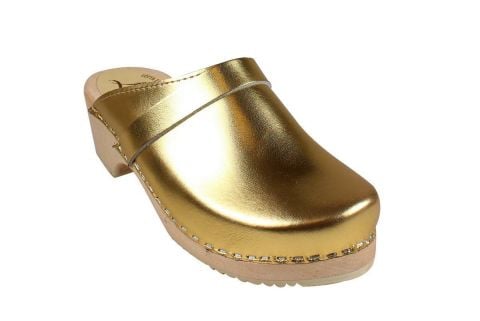 Gold clogs Women's clogs shoes in gold on wooden clogs base. 