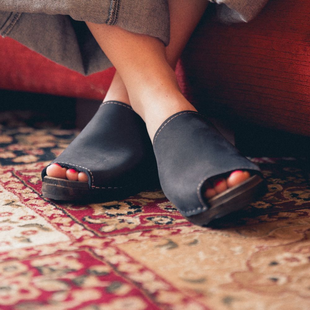 Womens clogs shoes mules in Black oiled nubuck leather on brown clogs wooden base. Berit by Lotta from Stockholm
