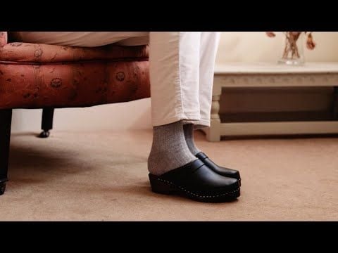 Classic Black Clogs on a Brown Base