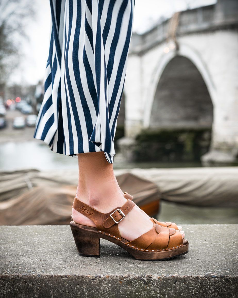 brown clogs in peep toe oiled nubuck with a high heel on a brown wooden clogs base with ankle strap and buckle by Lotta from Stockholm