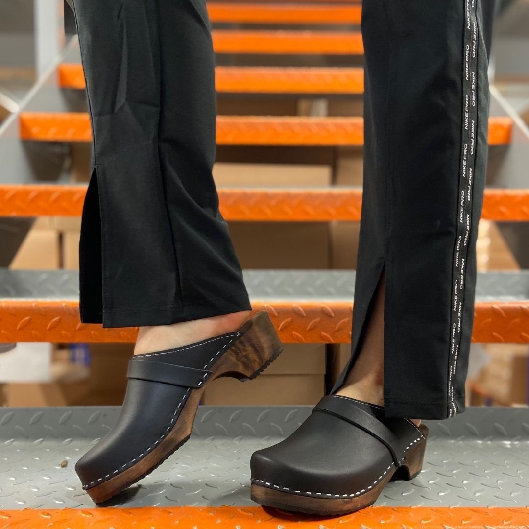 Classic Black Clogs on a Brown Base